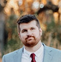 Professional headshot of Jeff Schaefer in business attire, confident technology consultant